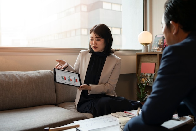 Business people working with ipad side view