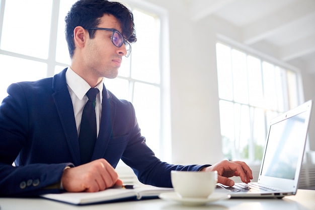 Man working with laptop at office