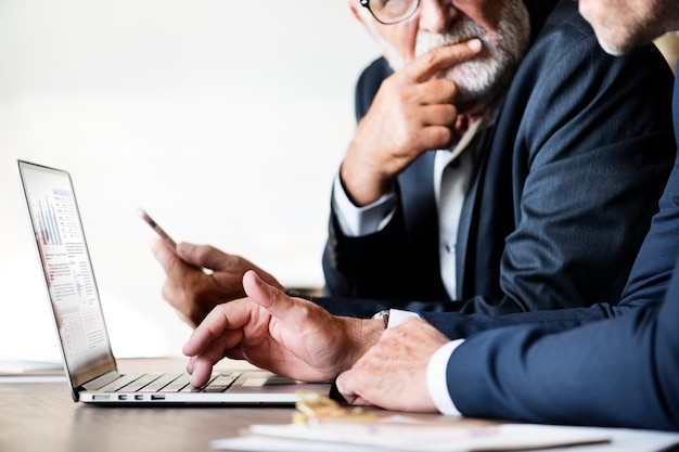 Businessmen using computer laptop