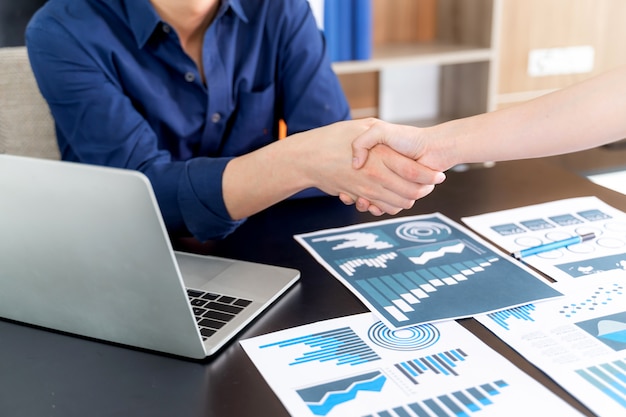 Selective focus young man handshake with someone at office